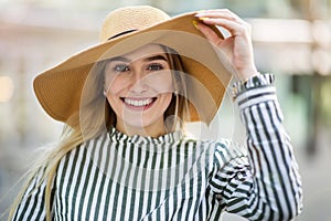 Attractive young womanÂ wearing straw hatÂ 